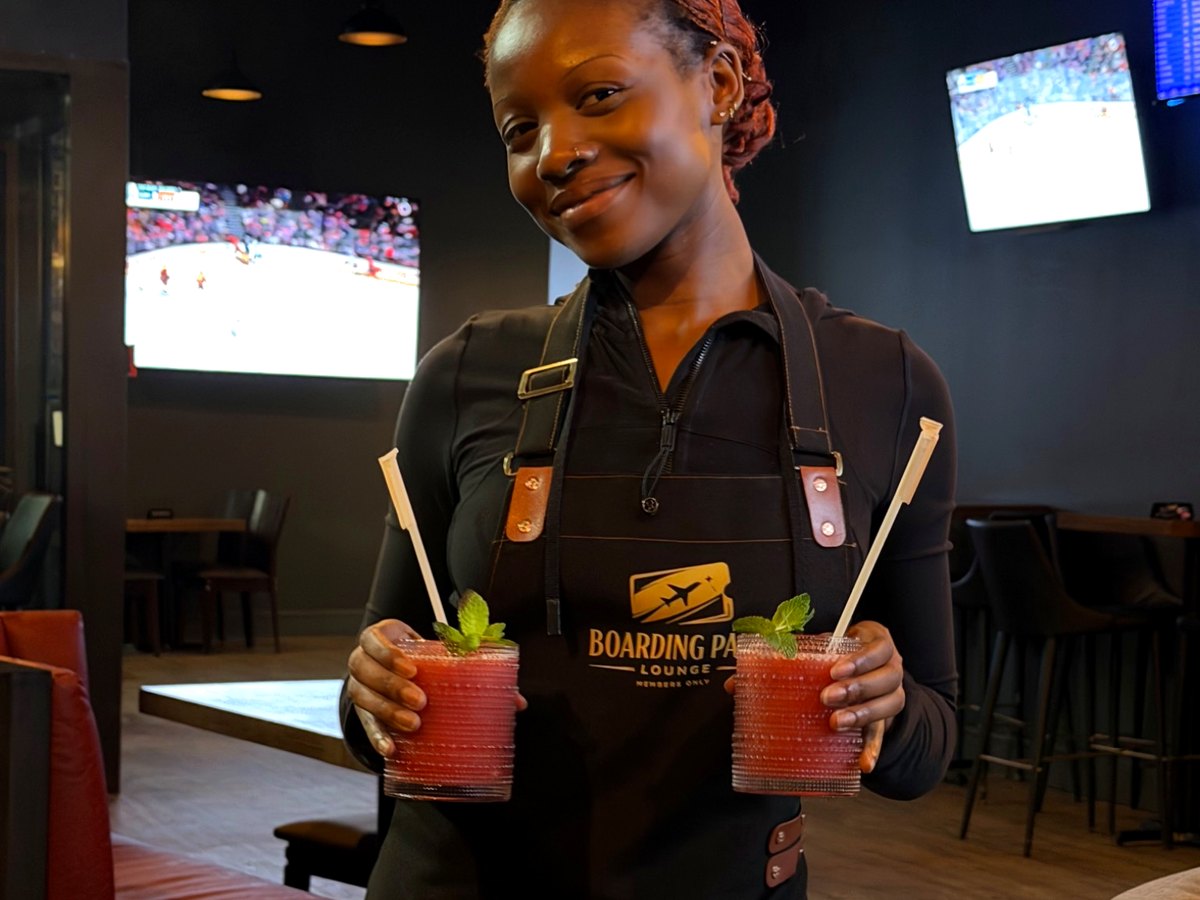 Boarding Pass Lounge staff serving drinks